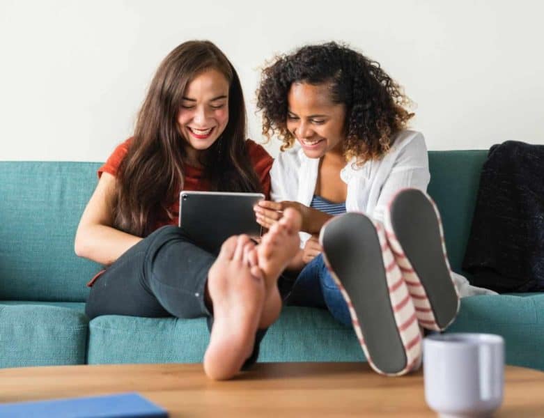 friends-smiling-at-tablet-computer