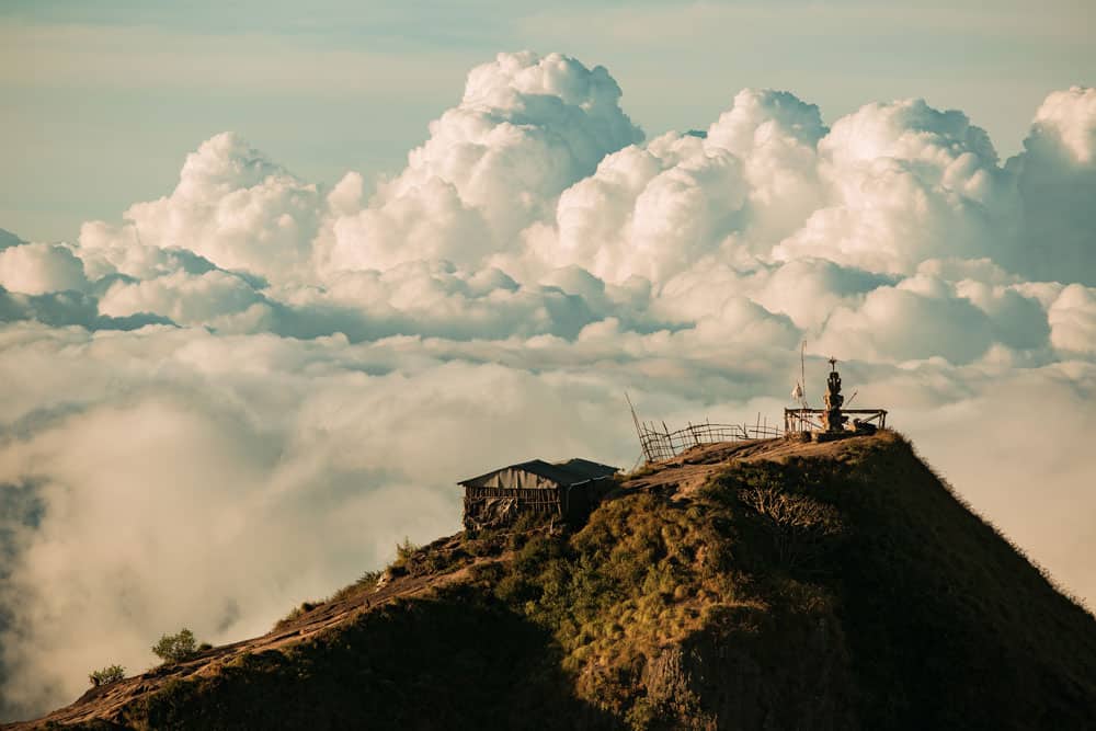 landscape-temple-clouds-top-batur-volcano-bali-indonesia