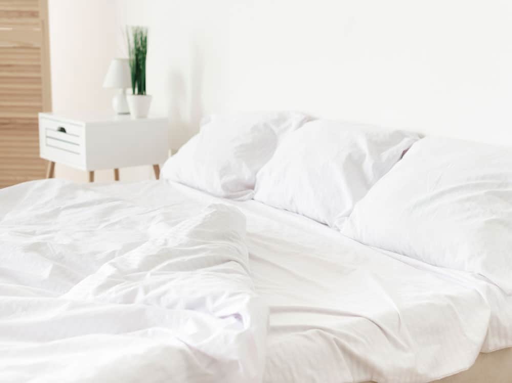 bright-modern-bedroom-with-white-sheets
