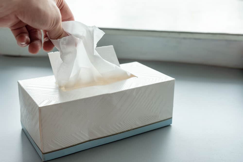 hand-picking-white-tissue-paper