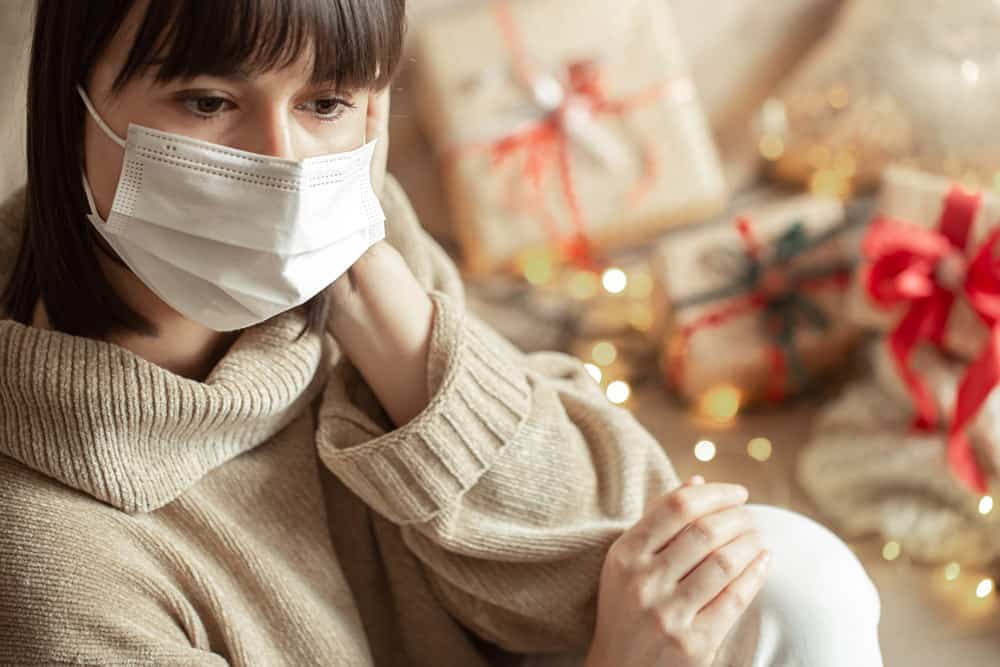 young-woman-with-mask-her-face-cozy-beige-sweater