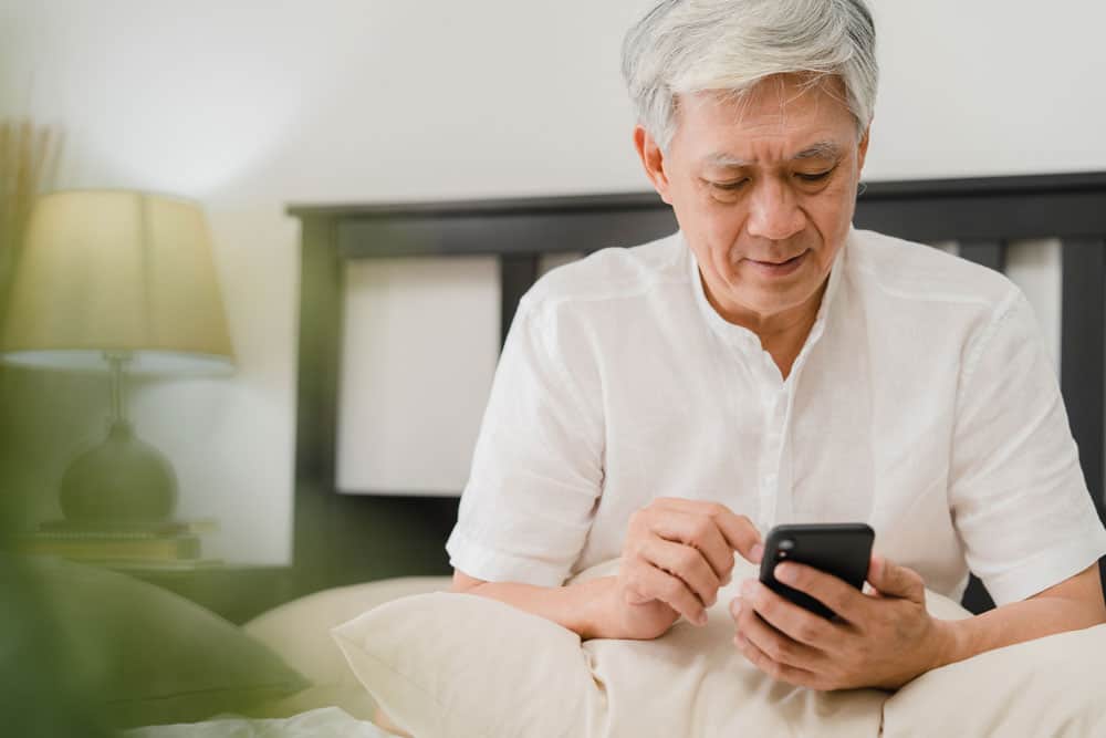 asian-senior-men-using-mobile-phone-home-asian-senior-chinese-male-search-information-about-how-good-health-internet-while-lying-bed-bedroom-home-morning-concept
