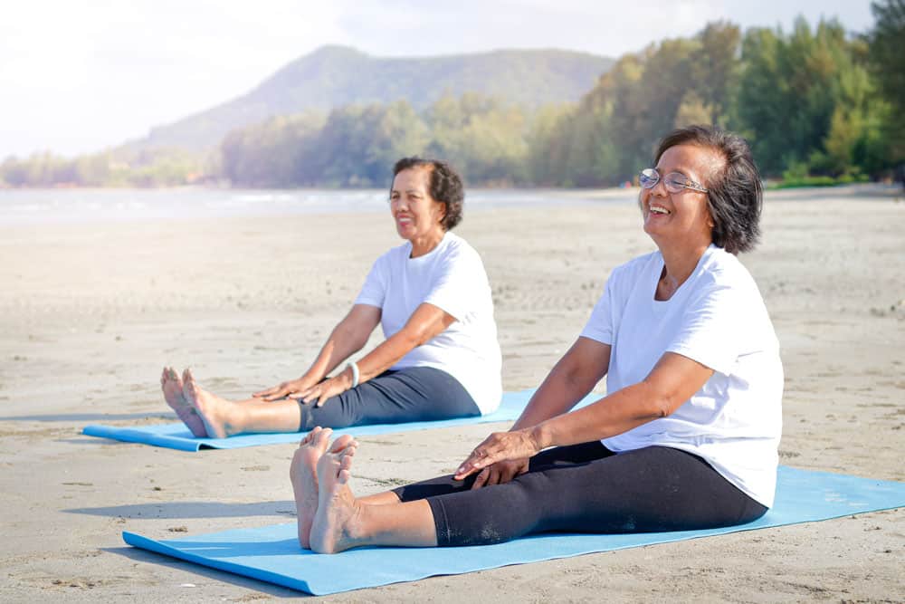 two-elderly-women-exercise-beach-happy-smile-concept-elderly-community